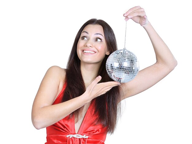 Stylish young woman with a mirror ball .photo with copy space