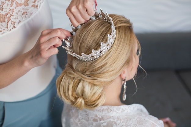 The stylist wears the crown bride