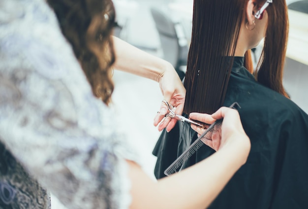 Stylist working in the beauty salon haircut and hair styling