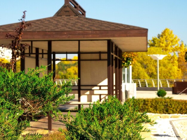 Stylized gazebo in a Japanese garden path made of stones and wooden boards