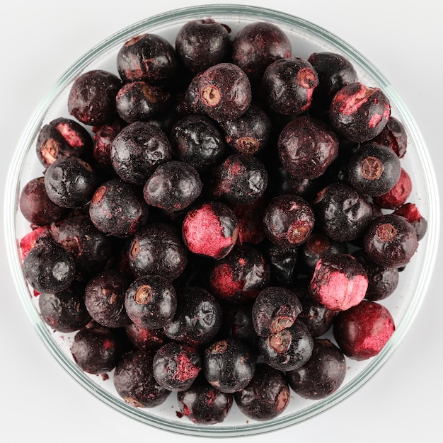 Photo sublimed dried blackcurrant pieces on plate