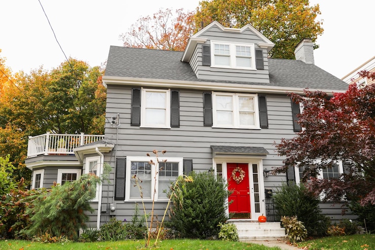 फोटो suburban house framed by a white picket fence symbolizing the american dream faces the skyward tre