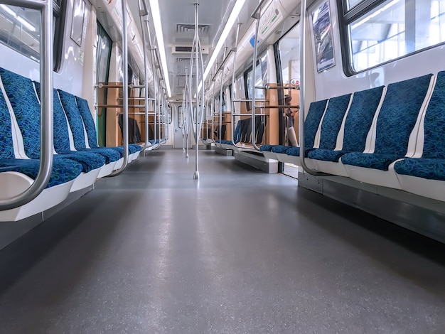 Subway car interior with colorful seats with no passengers