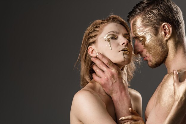 Success concept success and luxury concept with sexy couple painted in gold color copy space