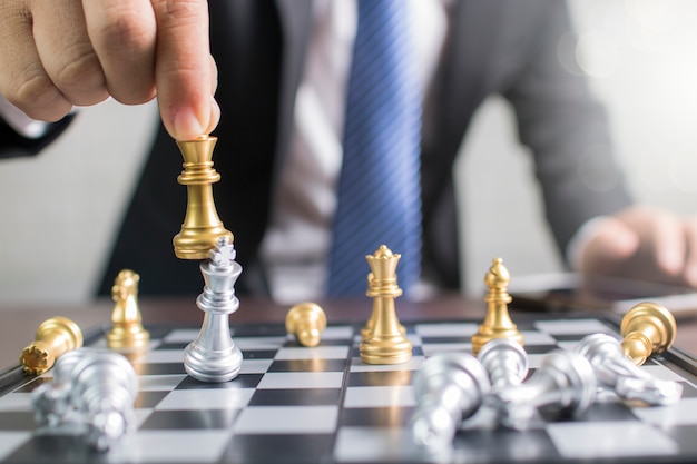 success, management and business leadership concept, businessman moving king chess to win