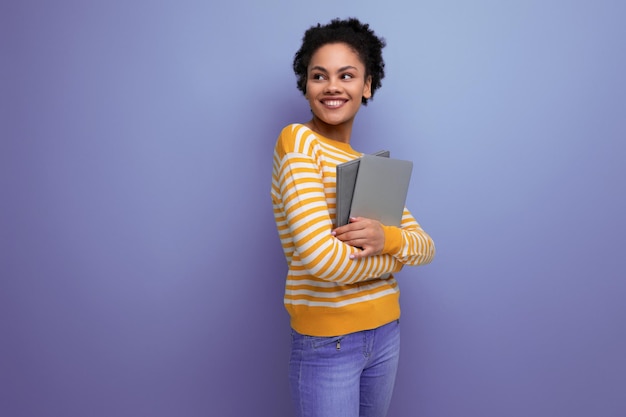 Successful afro brunette s latin young woman freelancer with laptop