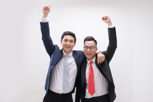 Successful Asian business man hands up feeling happy or win with background, Start up, Smart working, Success people, Partner and Teamwork concept