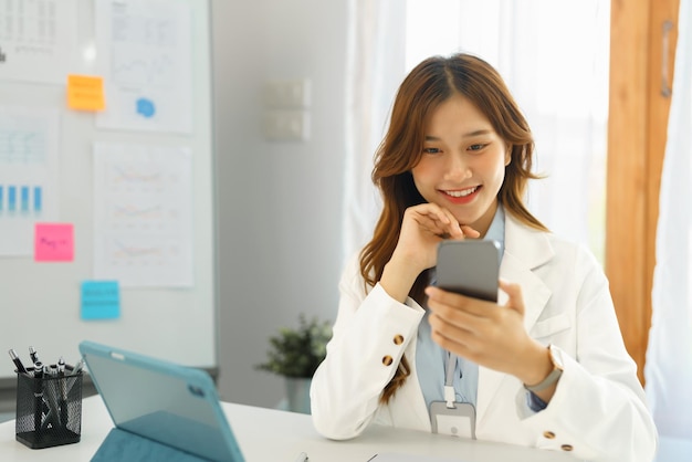 Successful business concept Businesswoman using smartphone to relaxation after hard working