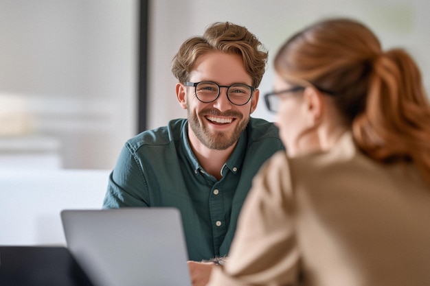 Photo successful business man using a laptop in a meeting with his colleague