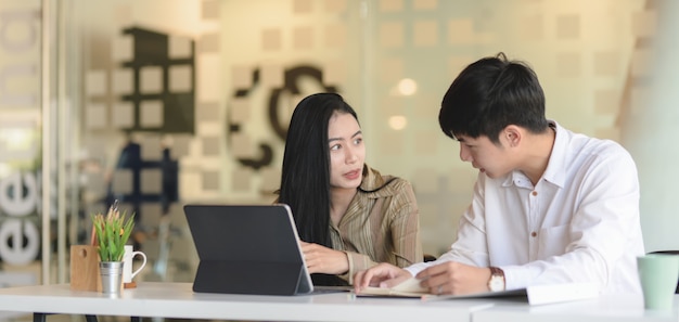 Successful business people discussing the strategy together in modern office room