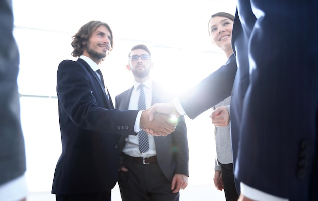 Successful business people handshaking after good deal