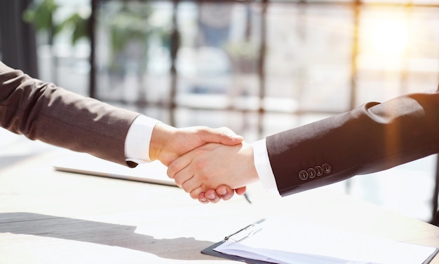 Successful business people handshaking after good deal
