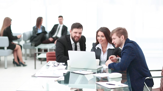 Successful business team uses a laptop to plan their work