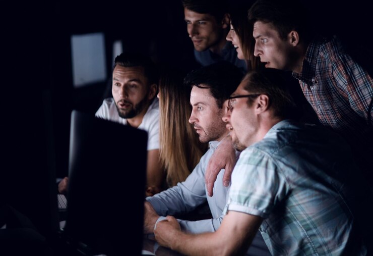 Photo successful business team in the workplace at nightphoto with copy space