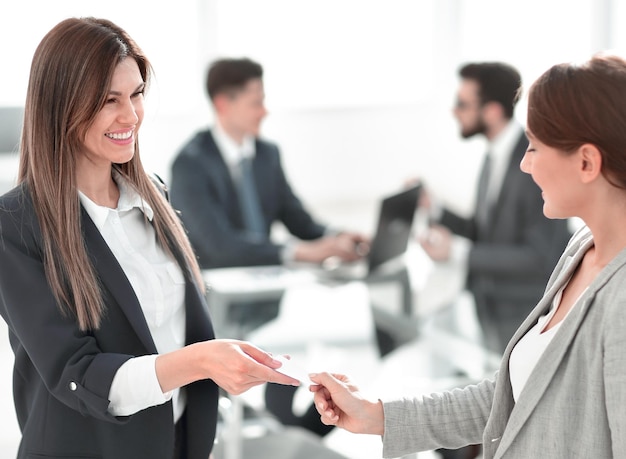 Successful business woman gives her business card