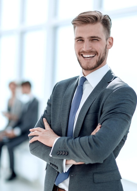 Successful businessman on the background of a bright office