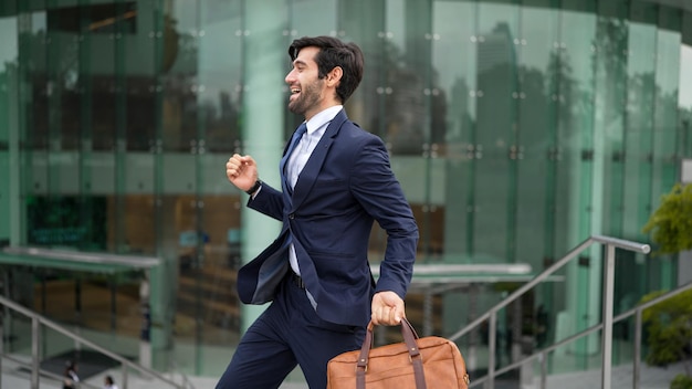 successful businessman celebrate for getting promotion while walking exultant