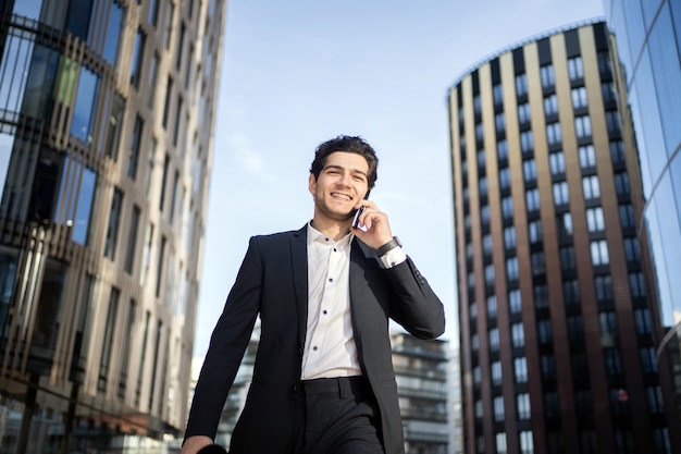 A successful businessman communicates with a colleague uses the phone goes to the office 