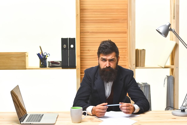 Successful businessman office worker portrait of bearded businessman serious businessman siting at