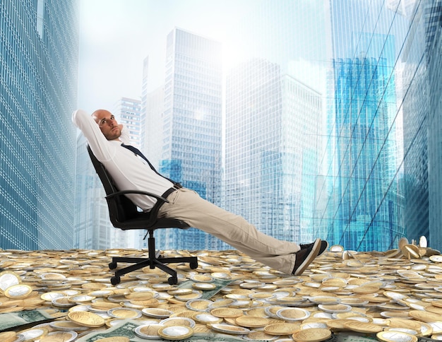 Successful businessman relaxing on a deckchair above an expanse of money