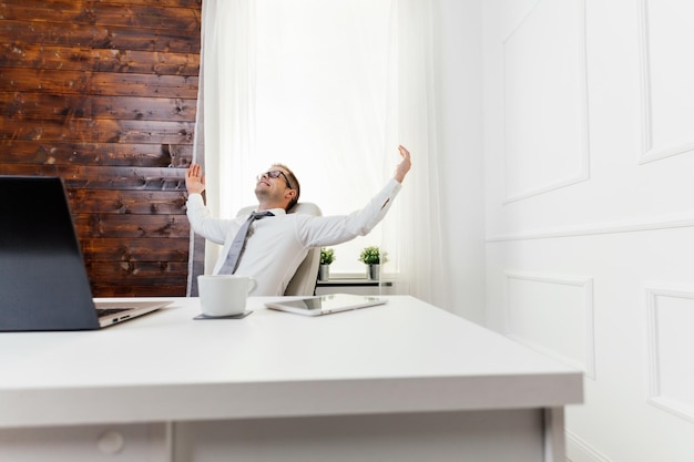 Successful businessman sitting in his office