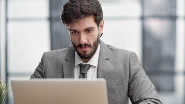 Successful businessman working inside office man in business suit working at workplace