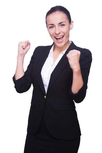 Photo successful businesswoman. happy young woman in formalwear gesturing and smiling while standing isolated on white