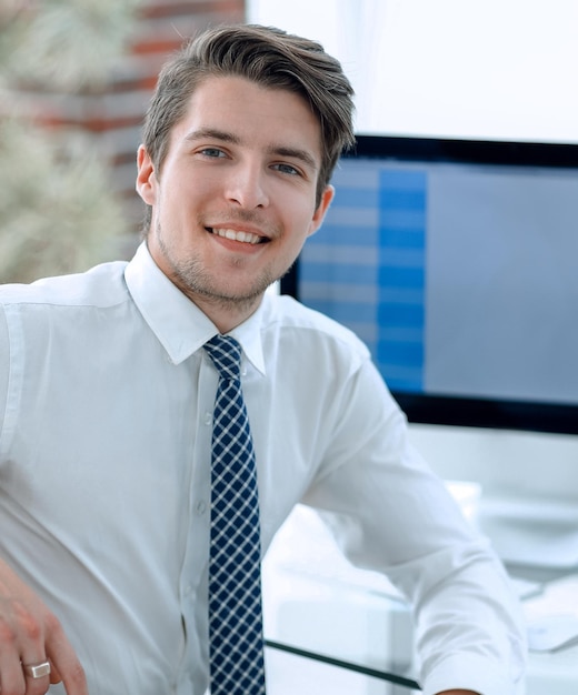 Successful employee sitting in front of a computer screenphoto with copy space