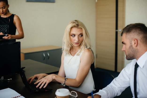 Successful employees in the office discuss new projects. Business, Finance