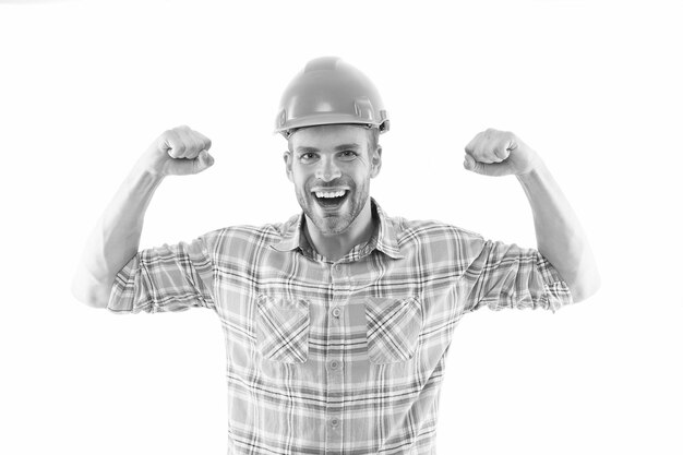 Successful engineer Strong handsome builder Man protective helmet and uniform white background Worker builder confident and successful Protective equipment concept Builder enjoy success