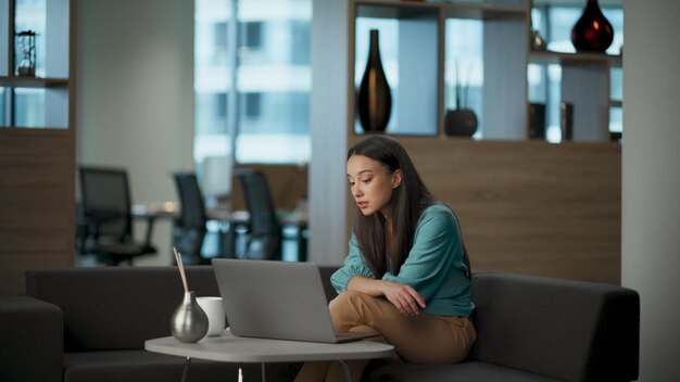 Successful entrepreneur chatting laptop video call lobby woman speaking virtual