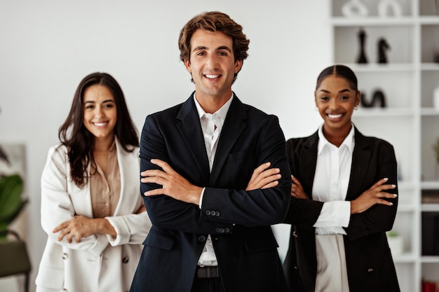 Successful european businessman standing in front of business team posing in office interior smiling