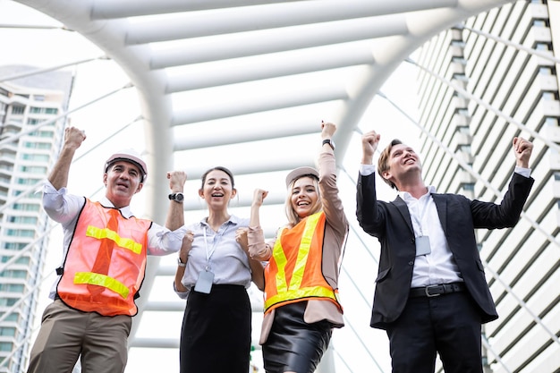 Successful group of business people and engineers with cheerful at outdoor in the city.