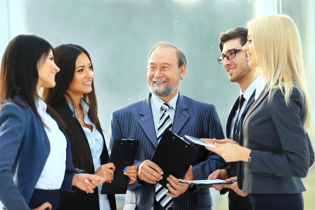 successful and happy business team with documents in office