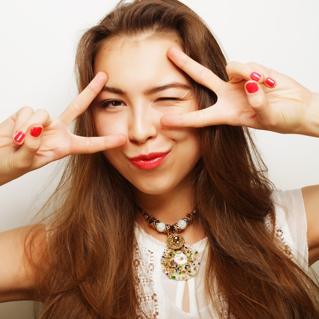 Successful happy girl gives thumb up with two hands