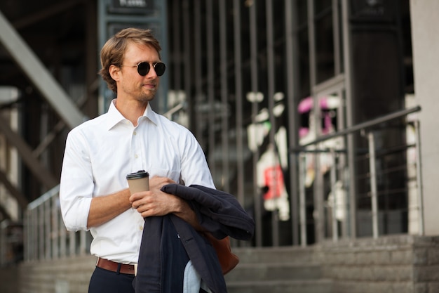 Successful And Lean CEO Drinks Coffee On The Street During The Break