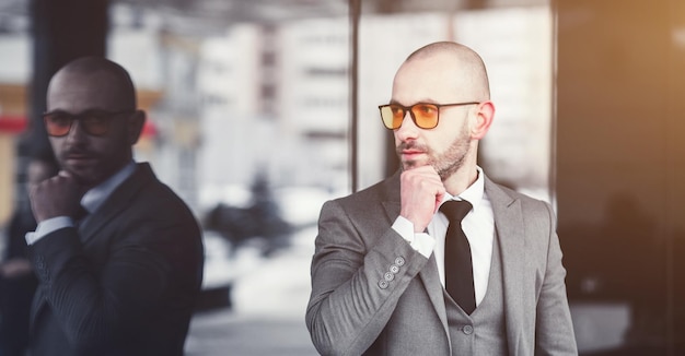 Successful man in gray suit looking away