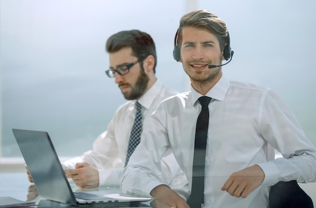 Successful managers sitting at the Desk photo with copy space