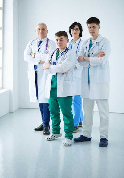 Successful medical team Confident doctors team standing together and smiling