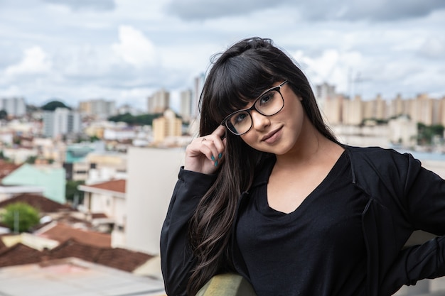 Successful smile businesswoman on top of a building.