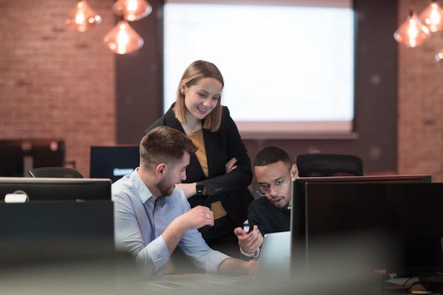 Successful team group of young business people working and communicating together in creative office