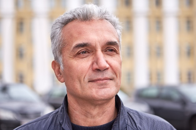 Successful well-groomed man over 50 years short gray hair pleased look casual clothes