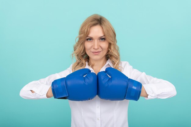 Successful woman in boxing gloves has business success, boss.