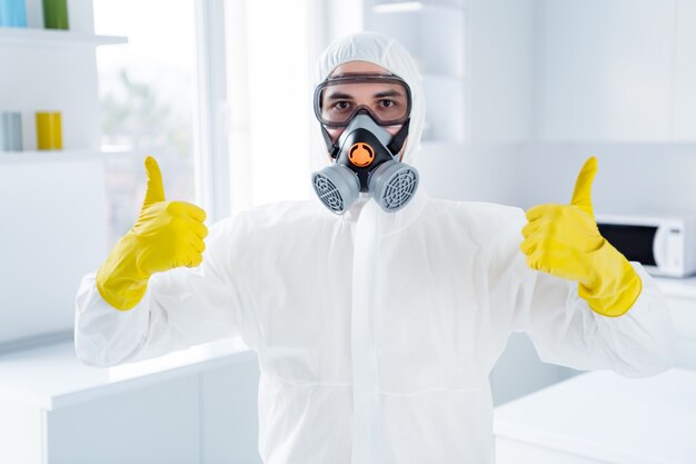 successful worker cleaner man in glasses gloves show thumb up symbol