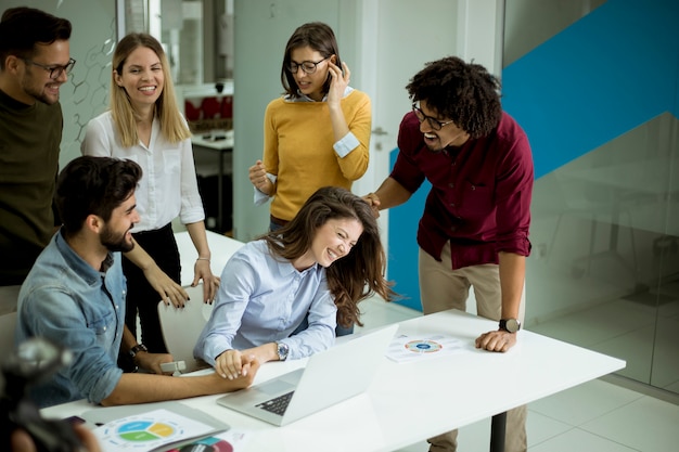 Successful young businesspeople having meeting in modern office