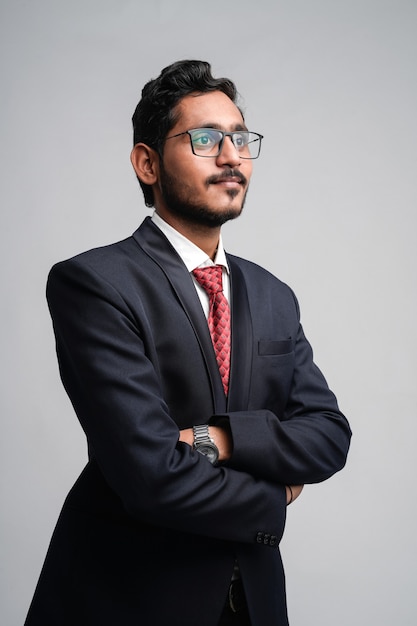 Successful Young indian business man posing