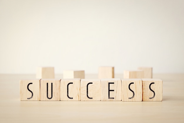 Sucess word on wooden cubes background