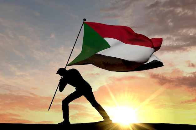 Sudan flag being pushed into the ground by a male silhouette 3D Rendering