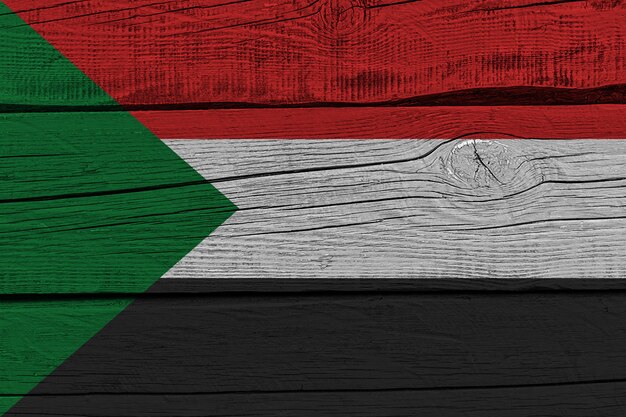 Sudan flag painted on old wood plank