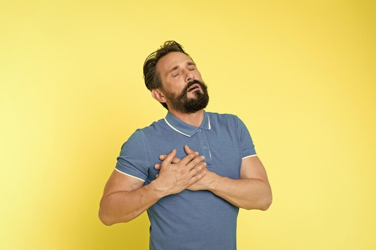 Photo sudden pain cardiology disease first infarction symptoms man mature painful face feel badly heart rate problem problems health appears with ageing man touch chest guy feels pain in heart